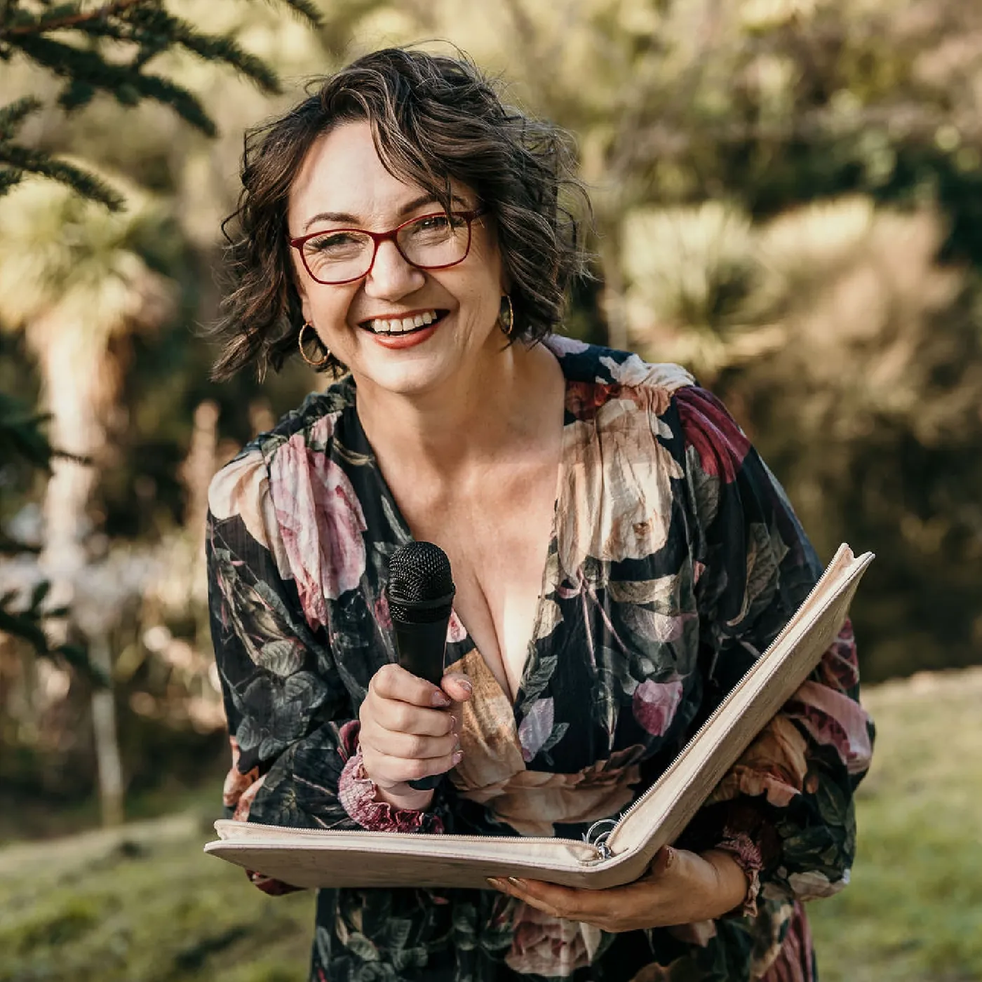 Lea-Anne reading from her ceremony book at an outdoor wedding
